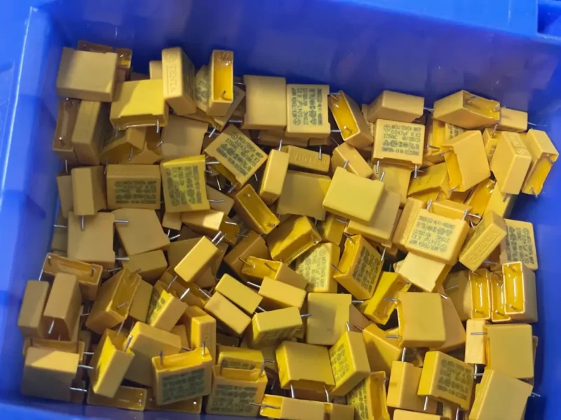 Massive reserves of high-quality yellow safety capacitors and electronic components inside WillPower's Shenzhen family-operated manufacturing facility.