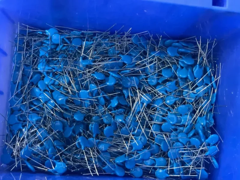 Heavy-duty blue varistors and surge protection components stocked in bulk inside Shenzhen Kaiming Technology factory for WillPower smart switch assembly.